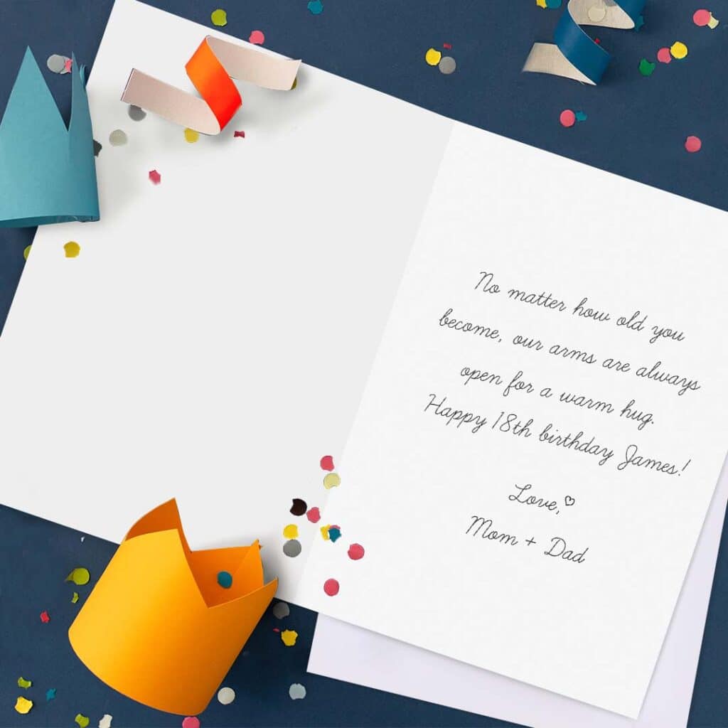 open birthday card with paper crown and confetti