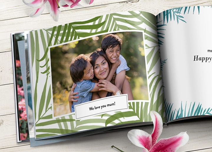 Open photo book showing photo of mother and children