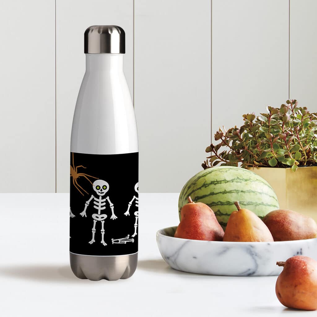 Water bottle with a bowl of fruit on the table