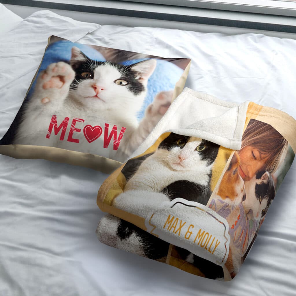 Cushion and personalised blanket with photos of a pet car laid on a bed